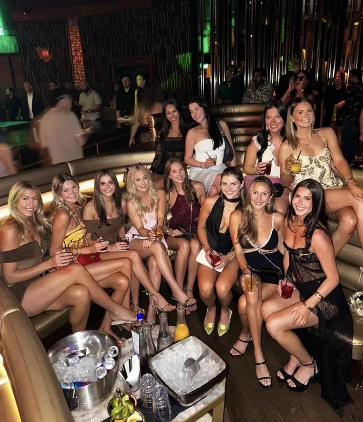 At the club. Pick one