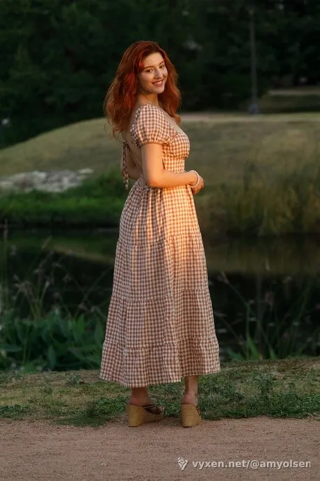 Redhead amateur Keely Rose unveils her natural tits next to a waterway (image 2 of 5)